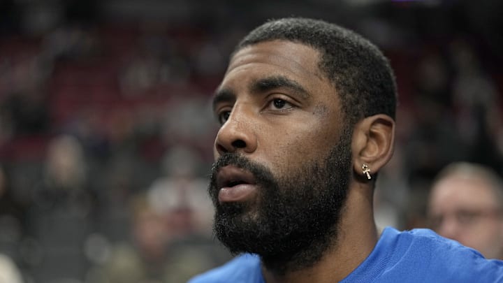 Dec 8, 2023; Portland, Oregon, USA; Dallas Mavericks point guard Kyrie Irving (11) runs to the court for warm ups before the game against the Portland Trail Blazers at Moda Center. Mandatory Credit: Soobum Im-Imagn Images