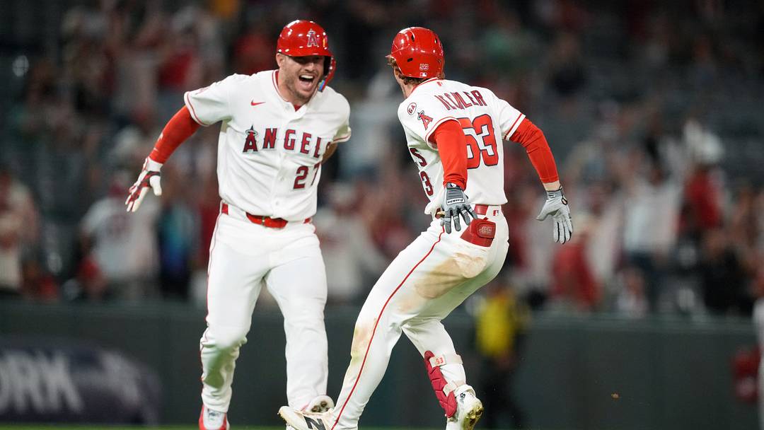 Sep 17, 2026; Anaheim, California, USA; Los Angeles Angels left fielder Wade Meckler (53) celebrates with designated hitter Mike Trout (27) after hitting a walk-off single in the 10th inning against the Minnesota Twins at Angel Stadium. Mandatory Credit: Kirby Lee-Imagn Images