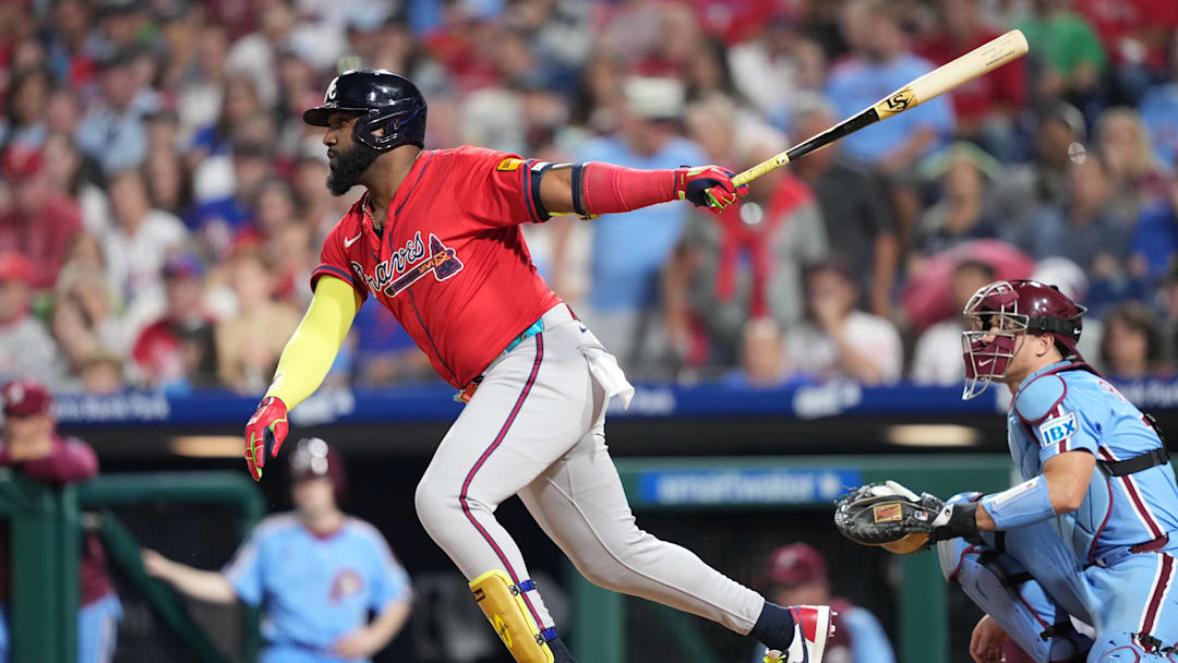 Aug 28, 2025; Philadelphia, Pennsylvania, USA; Atlanta Braves designated hitter Marcell Ozuna (20) hits a single against the Philadelphia Phillies in the seventh inning at Citizens Bank Park. Mandatory Credit: Kyle Ross-Imagn Images