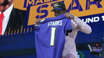Apr 24, 2025; Green Bay, WI, USA; NFL commissioner Roger Goodell with Georgia Bulldogs safety Malaki Starks after he is selected by the Baltimore Ravens as the number 27 pick in the first round of the 2025 NFL Draft at Lambeau Field. Mandatory Credit: Kirby Lee-Imagn Images