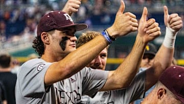 Jun 17, 2024; Omaha, NE, USA; Texas A&M Aggies right fielder Jace Laviolette (17) and designated hitter Hayden Schott (5) celebrate after defeating the Kentucky Wildcats at Charles Schwab Field Omaha. Mandatory Credit: Dylan Widger-USA TODAY Sports