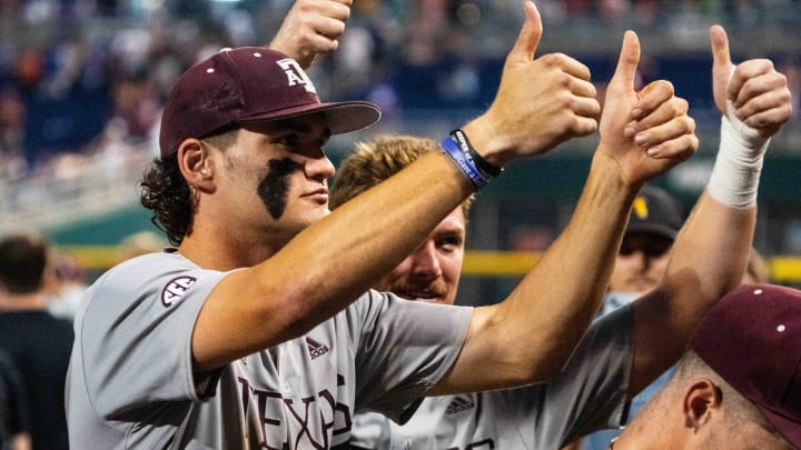 Jun 17, 2024; Omaha, NE, USA; Texas A&M Aggies right fielder Jace Laviolette (17) and designated hitter Hayden Schott (5) celebrate after defeating the Kentucky Wildcats at Charles Schwab Field Omaha. Mandatory Credit: Dylan Widger-USA TODAY Sports