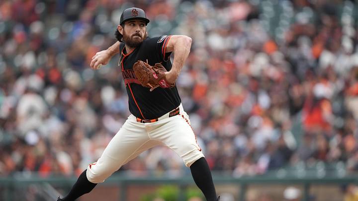 Apr 25, 2026; San Francisco, California, USA; San Francisco Giants pitcher Ryan Walker (74) throws a pitch against the Miami Marlins during the ninth inning at Oracle Park. Mandatory Credit: Darren Yamashita-Imagn Images