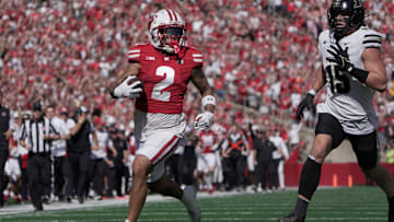 Wisconsin wide receiver Trech Kekahuna (2) scores a touchdown on a 69-yard reception as Purdue defensive back Botros Alisandro (19) looks on during the third quarter of their game Saturday, October 5, 2024 at Camp Randall Stadium in Madison, Wisconsin.
