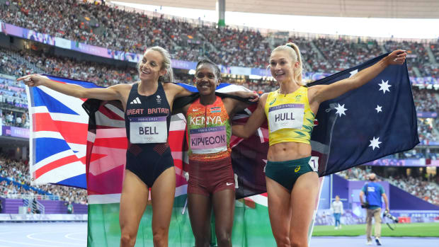 Georgia Bell, left, poses with fellow 1,500-meter medalists