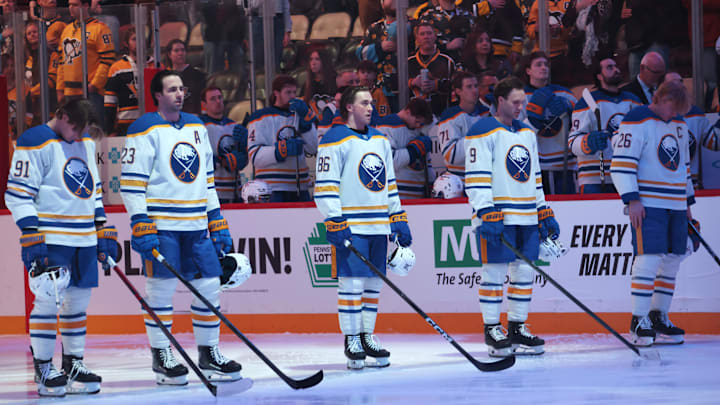Mar 5, 2026; Pittsburgh, Pennsylvania, USA;  Buffalo Sabres starting line-up including right wing Josh Doan (91) and defenseman Mattias Samuelsson (23) and center Noah Ostlund (86) and center Josh Norris (9) and defenseman Rasmus Dahlin (26) stand for the national anthem against the Pittsburgh Penguins at PPG Paints Arena. Mandatory Credit: Charles LeClaire-Imagn Images