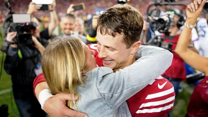 Jan 28, 2024: San Francisco 49ers quarterback Brock Purdy kisses his now wife Jenna Brandt after winning the NFC Championship.