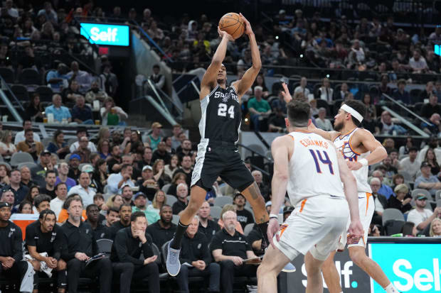 San Antonio Spurs guard Devin Vassell (24) shoots in the first half against the Phoenix Suns at Frost Bank Center. 