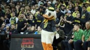Feb 11, 2023; Eugene, Oregon, USA; Oregon Ducks mascot Puddles leads a cheer during a time out in the first half against the UCLA Bruins at Matthew Knight Arena.