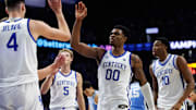 Dec 2, 2025; Lexington, Kentucky, USA; Kentucky Wildcats guard Otega Oweh (00) high-fives forward Andrija Jelavic (4) during the second half against the North Carolina Tar Heels at Rupp Arena at Central Bank Center. Mandatory Credit: Jordan Prather-Imagn Images