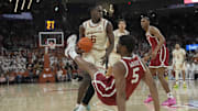 Texas forward Arthur Kaluma fouls Oklahoma forward Mohamed Wague (5) 