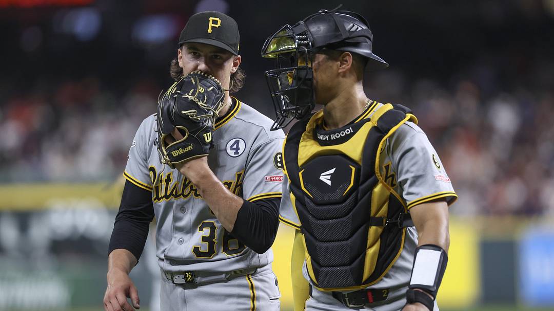 Pittsburgh Pirates starting pitcher Bubba Chandler talks with catcher Endy Rodriguez.