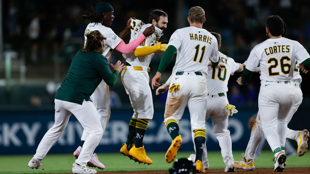 Sep 26, 2025; West Sacramento, California, USA; Athletics catcher Shea Langeliers (23) celebrates with teammates after hitting a walk-off RBI double during the ninth inning against the Kansas City Royals at Sutter Health Park. Mandatory Credit: Sergio Estrada-Imagn Images