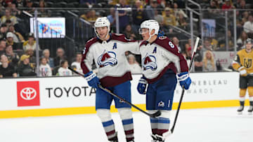 Oct 9, 2024; Las Vegas, Nevada, USA; Colorado Avalanche right wing Mikko Rantanen (96) celebrates with defenseman Cale Makar (8) after scoring a goal against the Vegas Golden Knights during the third period at T-Mobile Arena. Mandatory Credit: Lucas Peltier-Imagn Images