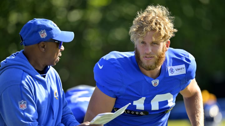 Jul 29, 2024; Los Angeles, CA, USA; Los Angeles Rams wide receiver Cooper Kupp (10) talks with wide receiver coach Eric Yarber during training camp at Loyola Marymount University. Mandatory Credit: Jayne Kamin-Oncea-USA TODAY Sports