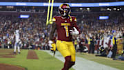 Nov 9, 2025; Landover, Maryland, USA; Washington Commanders wide receiver Deebo Samuel Sr. (1) reacts after scoring a touchdown during the third quarter against the Detroit Lions at Northwest Stadium. 