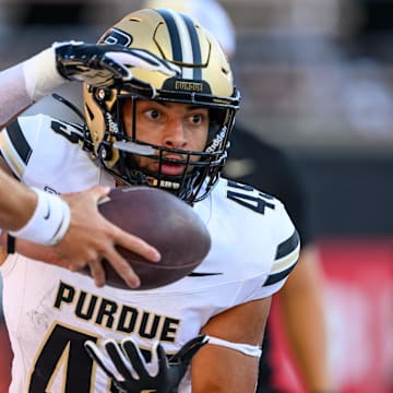 Purdue Boilermakers running back Devin Mockobee (45) takes a handoff