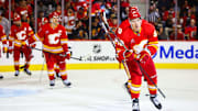 Oct 15, 2024; Calgary, Alberta, CAN; Calgary Flames left wing Andrei Kuzmenko (96) celebrates his goal with teammates against the Chicago Blackhawks during the second period at Scotiabank Saddledome. Mandatory Credit: Sergei Belski-Imagn Images