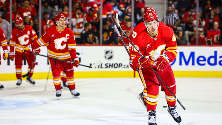 Oct 15, 2024; Calgary, Alberta, CAN; Calgary Flames left wing Andrei Kuzmenko (96) celebrates his goal with teammates against the Chicago Blackhawks during the second period at Scotiabank Saddledome. Mandatory Credit: Sergei Belski-Imagn Images
