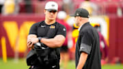 Cincinnati Bengals defensive end Trey Hendrickson (91) talks with director of player personnel Duke Tobin before the first quarter of the NFL Preseason Week 2 game between the Washington Commanders and the Cincinnati Bengals at Northwest Stadium in Landover, Md., on Monday, Aug. 18, 2025.