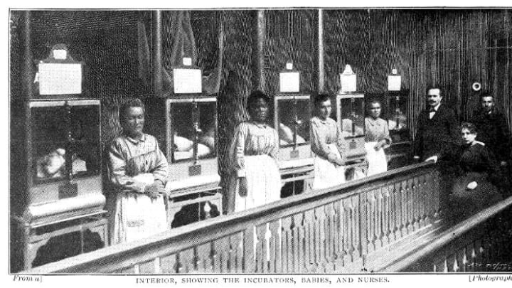 A row of baby incubators attended by Dr. Alexandre Lion (right) and nurses in 1896.