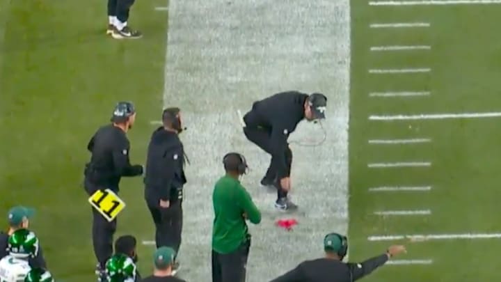 New York Jets head coach Jeff Ulbrich dropped a challenge flag during the first half against the Pittsburgh Steelers. 