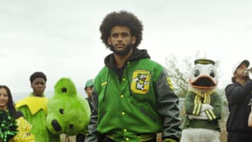 Dante Moore models a jacket for the University of Oregon x Nike x Class Trip x Grateful Dead collection.