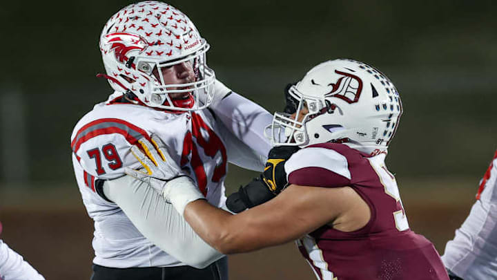 Nixa's Jackson Cantwell (79) blocks De Smet Jesuit's Titan Davis during the Missouri Class 6 Show-Me Bowl in 2024. Cantwell, a Miami Hurricanes commit, is rated the No. 1 2026 prospect in Missouri. Davis, a Michigan Wolverines commit, is rated No. 2.
