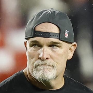 Washington Commanders head coach Dan Quinn looks on before the game against the Chicago Bears.