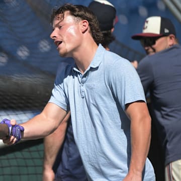 Jul 19, 2024; Cleveland, Ohio, USA; Cleveland Guardians number one draft pick Travis Bazzana, right, shakes hands with third baseman Jose Ramirez (11) before the game between the Cleveland Guardians and the San Diego Padres at Progressive Field. Mandatory Credit: Ken Blaze-Imagn Images