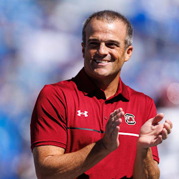 Sep 7, 2024; Lexington, Kentucky, USA; South Carolina Gamecocks head coach Shane Beamer claps during warm-ups before the game against the Kentucky Wildcats at Kroger Field. Mandatory Credit: Jordan Prather-Imagn Images
