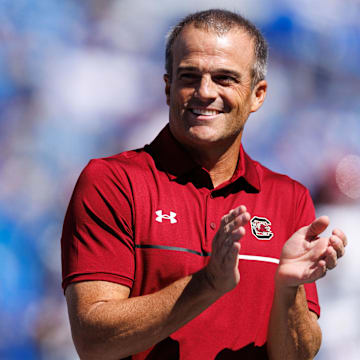 Sep 7, 2024; Lexington, Kentucky, USA; South Carolina Gamecocks head coach Shane Beamer claps during warm-ups before the game against the Kentucky Wildcats at Kroger Field. Mandatory Credit: Jordan Prather-Imagn Images