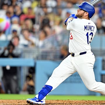Aug 5, 2025; Los Angeles, California, USA; Los Angeles Dodgers third baseman Max Muncy (13) hits a two run home run during the third inning against the St. Louis Cardinals at Dodger Stadium. Mandatory Credit: William Liang-Imagn Images