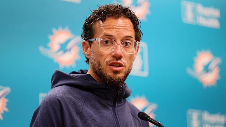 Aug 15, 2024; Miami Gardens, FL, USA; Miami Dolphins head coach Mike McDaniel talks to reporters before joint practice with the Washington Commanders at Baptist Health Training Complex. Mandatory Credit: Sam Navarro-Imagn Images