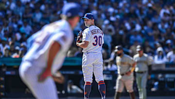 Apr 12, 2023; New York City, New York, USA; New York Mets relief pitcher David Robertson (30) checks the runner on first base during the seventh inning against the San Diego Padres at Citi Field. Mandatory Credit: John Jones-Imagn Images