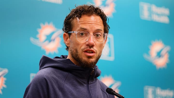 Aug 15, 2024; Miami Gardens, FL, USA; Miami Dolphins head coach Mike McDaniel talks to reporters before joint practice with the Washington Commanders at Baptist Health Training Complex. Mandatory Credit: Sam Navarro-Imagn Images