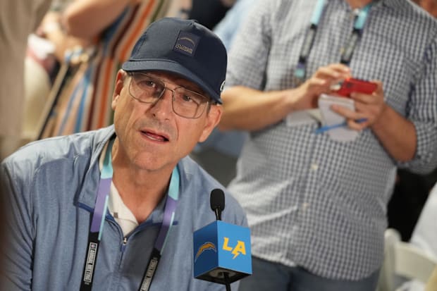 Los Angeles Chargers head coach Jim Harbaugh answers questions during the NFL Annual League Meeting.