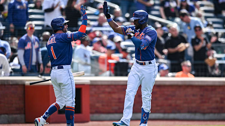 Jun 4, 2023; New York City, New York, USA; New York Mets right fielder Starling Marte (6) is greeted