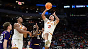 Mar 21, 2025; Milwaukee, WI, USA; Iowa State Cyclones guard Tamin Lipsey (3) shoots against Lipscomb Bisons guard Gyasi Powell (10) during the first half of a first round NCAA men’s tournament game at Fiserv Forum. Mandatory Credit: Benny Sieu-Imagn Images