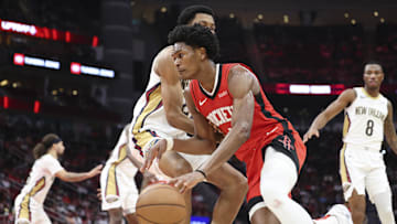 Mar 8, 2025; Houston, Texas, USA;  Houston Rockets forward Amen Thompson (1) dribbles the ball during the game against the New Orleans Pelicans at Toyota Center. Mandatory Credit: Troy Taormina-Imagn Images