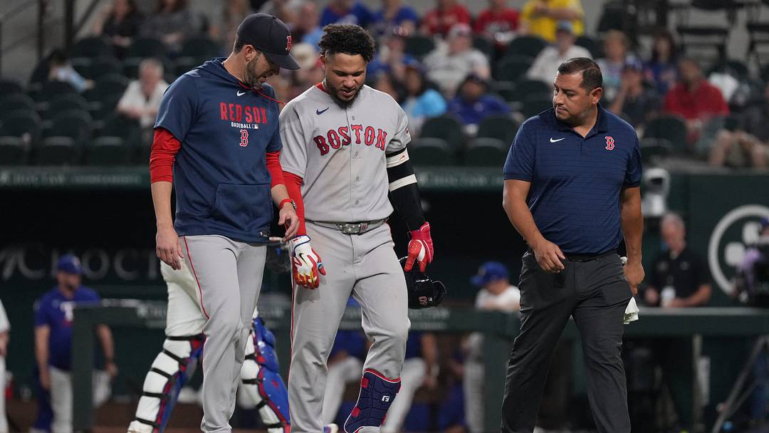 Sep 17, 2026; Arlington, Texas, USA;  Boston Red Sox first baseman Willson Contreras (40) leaves the game with interim manager Chad Tracy (17) after being hit by a pitch during the eighth inning against the Texas Rangers at Globe Life Field. Mandatory Credit: Raymond Carlin III-Imagn Images