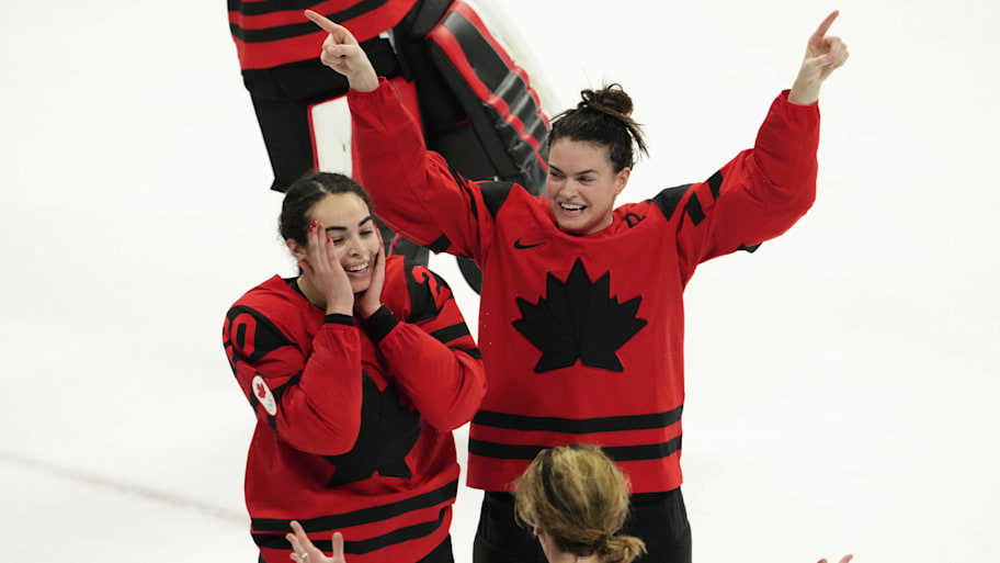 Team Canada forward Sarah Nurse, Blayre Turnbull, Marie-Philip Poulin after winning gold at the Beijing 2022 Olympics.