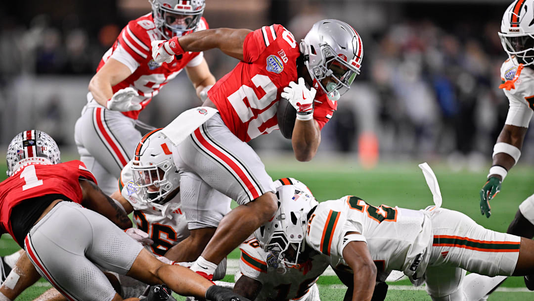 Dec 31, 2025; Arlington, TX, USA; Ohio State Buckeyes running back James Peoples (20) runs with the ball in the third quarter against the Miami Hurricanes during the 2025 Cotton Bowl and quarterfinal game of the College Football Playoff at AT&T Stadium. Mandatory Credit: Jerome Miron-Imagn Images