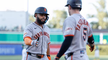 Jul 6, 2025; West Sacramento, California, USA; San Francisco Giants left fielder Heliot Ramos (17) celebrates with right fielder Mike Yastrzemski (5) after scoring a run during the first inning against the Athletics at Sutter Health Park.