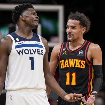 Mar 13, 2023; Atlanta, Georgia, USA; Minnesota Timberwolves guard Anthony Edwards (1) reacts with Atlanta Hawks guard Trae Young (11) during the second half at State Farm Arena. Mandatory Credit: Dale Zanine-USA TODAY Sports