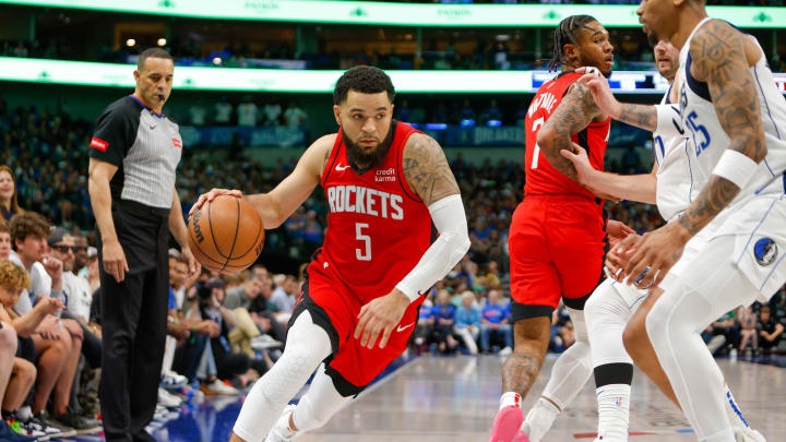 Apr 7, 2024; Dallas, Texas, USA; Houston Rockets guard Fred VanVleet (5) tries to turn the corner during the fourth quarter with Dallas Mavericks forward P.J. Washington (25) defending at American Airlines Center. Mandatory Credit: Andrew Dieb-USA TODAY Sports