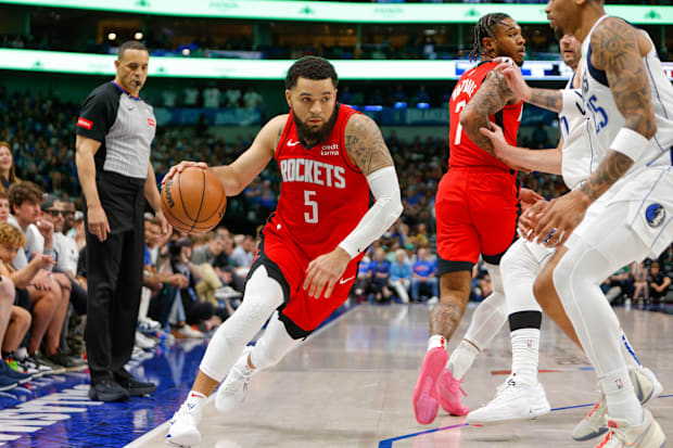  Houston Rockets guard Fred VanVleet (5) tries to turn the corner against the Dallas Mavericks during the 2023-24 season. 