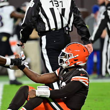 Nov 16, 2025; Cleveland, Ohio, USA; Cleveland Browns tight end David Njoku (85) helps up quarterback Shedeur Sanders (12) following a thrown interception during the third quarter against the Baltimore Ravens at Huntington Bank Field. Mandatory Credit: Ken Blaze-Imagn Images