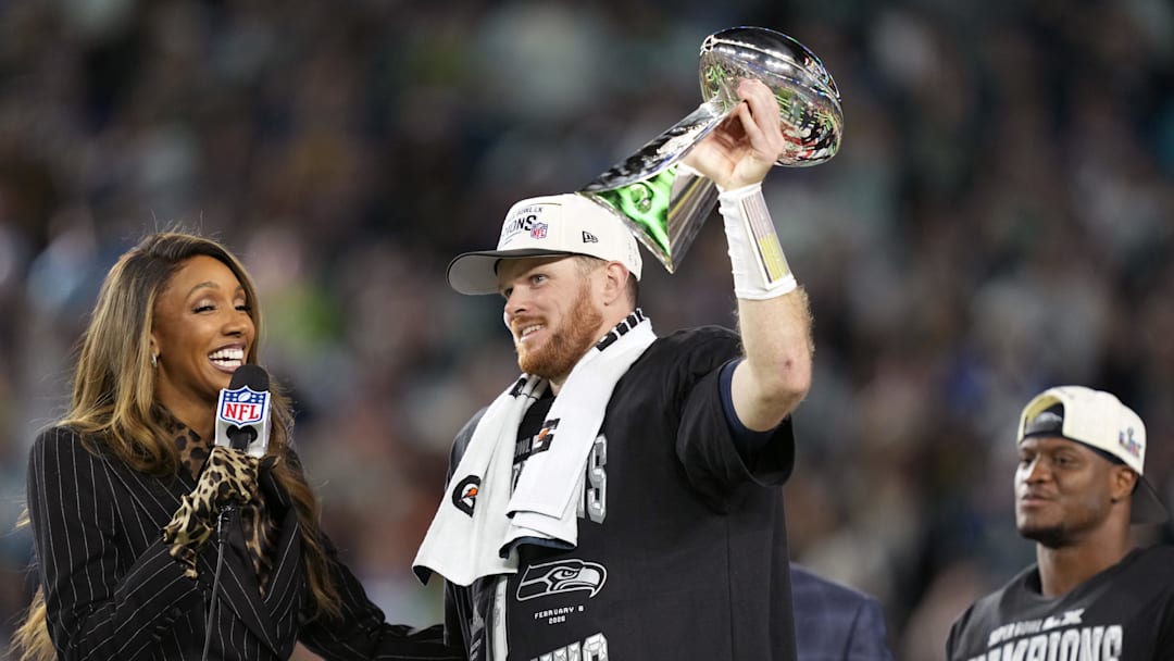 Feb 8, 2026; Santa Clara, CA, USA; Seattle Seahawks quarterback Sam Darnold (14) celebrates with the Vince Lombardi trophy after defeating the New England Patriots in Super Bowl LX at Levi's Stadium. Mandatory Credit: Kyle Terada-Imagn Images