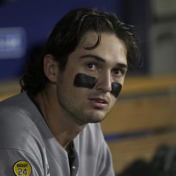 May 15, 2025; Los Angeles, California, USA;  Athletics second baseman Jacob Wilson (5) looks on from the dugout in the sixth inning against the Los Angeles Dodgers at Dodger Stadium. Mandatory Credit: Jayne Kamin-Oncea-Imagn Images